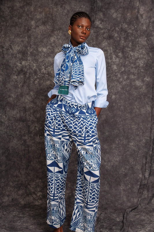 Model wearing Tchida Scarf tied around neck with matching print trousers