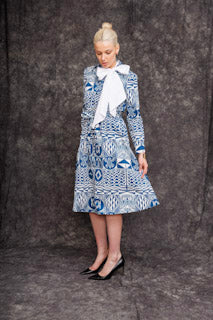 Model wearing Fatime Shirt Dress in blue heritage print with black heels