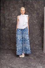 Model wearing Fokpi Palazzo Pants with sleeveless white top