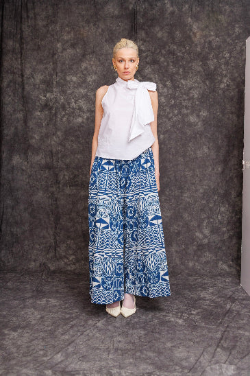 Model wearing Fokpi Palazzo Pants with sleeveless white top