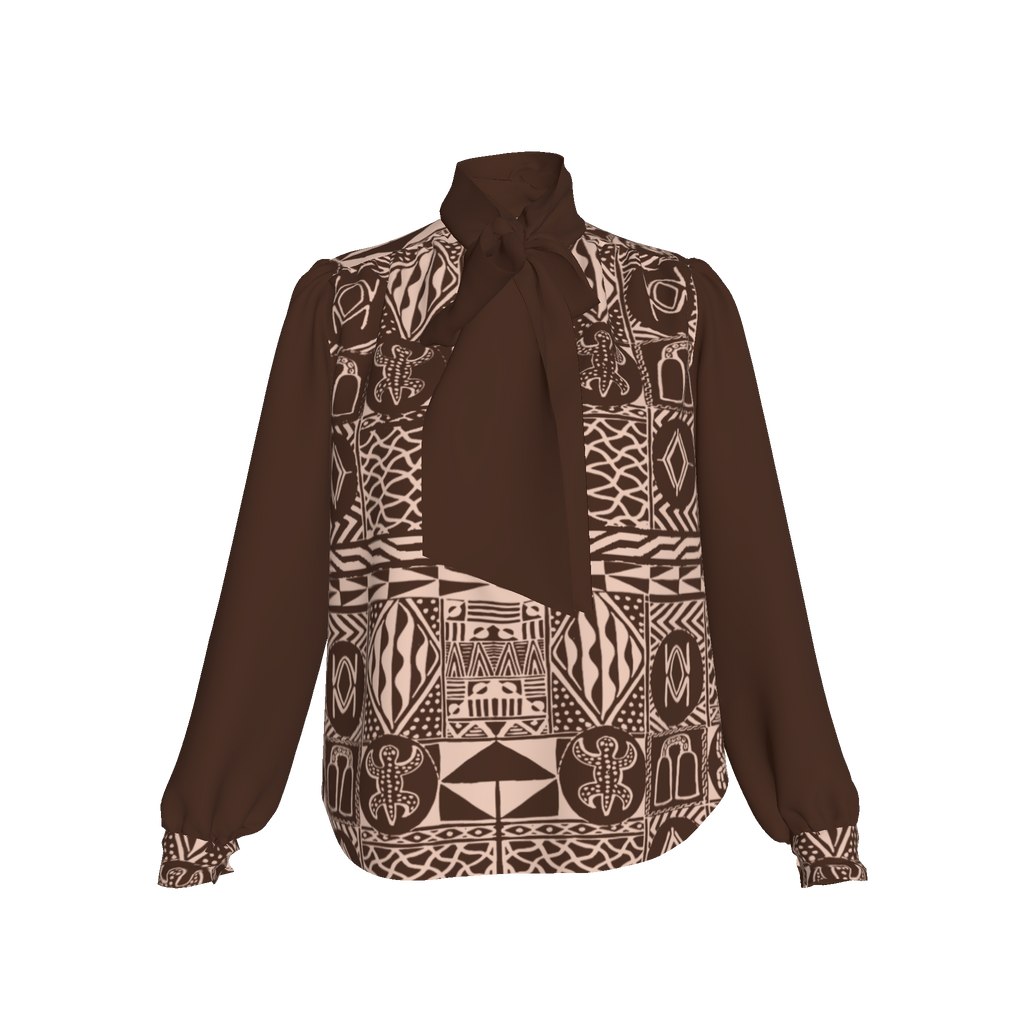 Flat lay of mocha silk blouse with African heritage print details