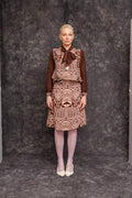 Model wearing Ngassa Circle Skirt styled with long-sleeve blouse