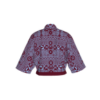 Back of Noumbissi shirt showing color-blocked detail and traditional African patterns