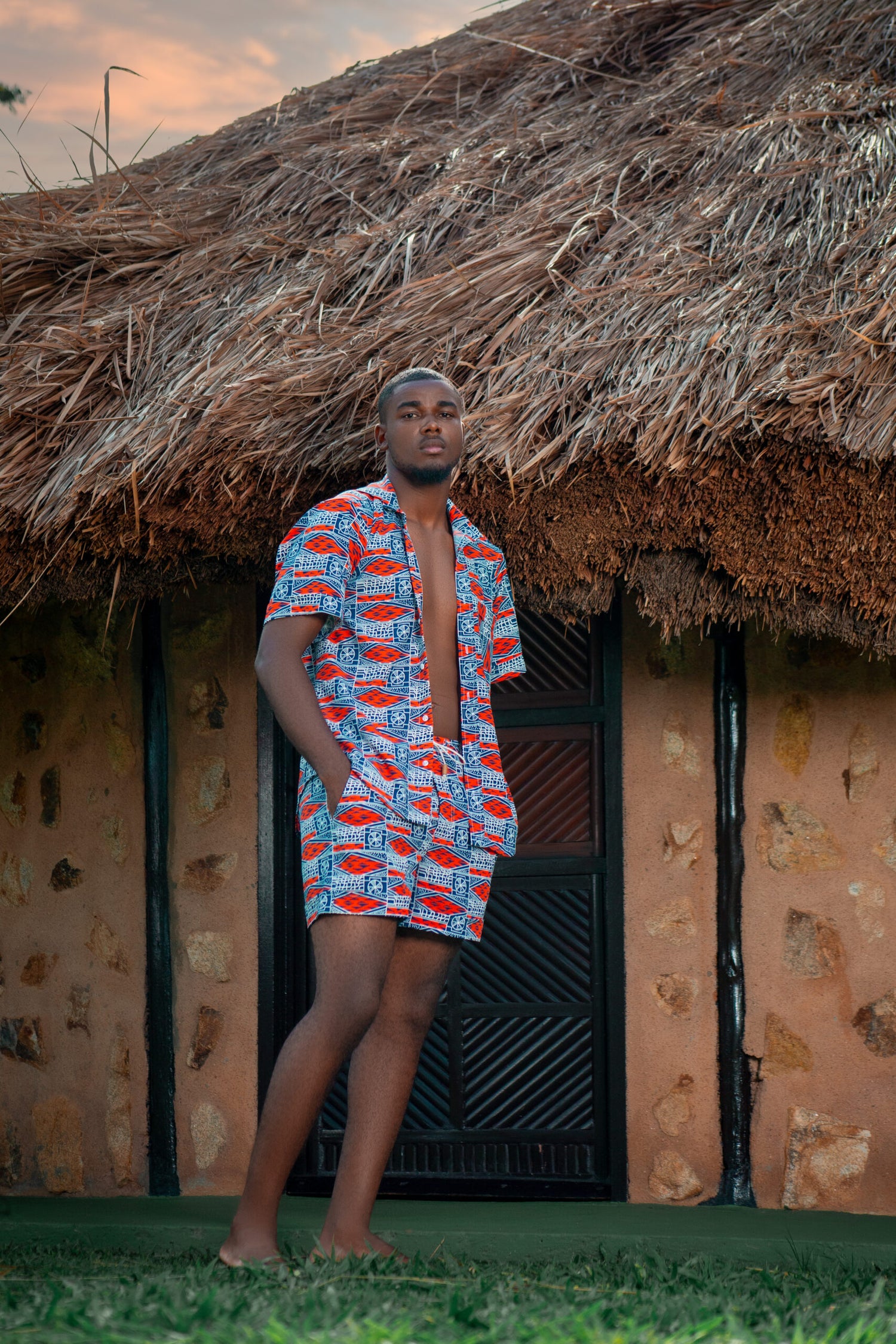 Front view of Orange Bami Bermuda Set in vibrant tribal pattern