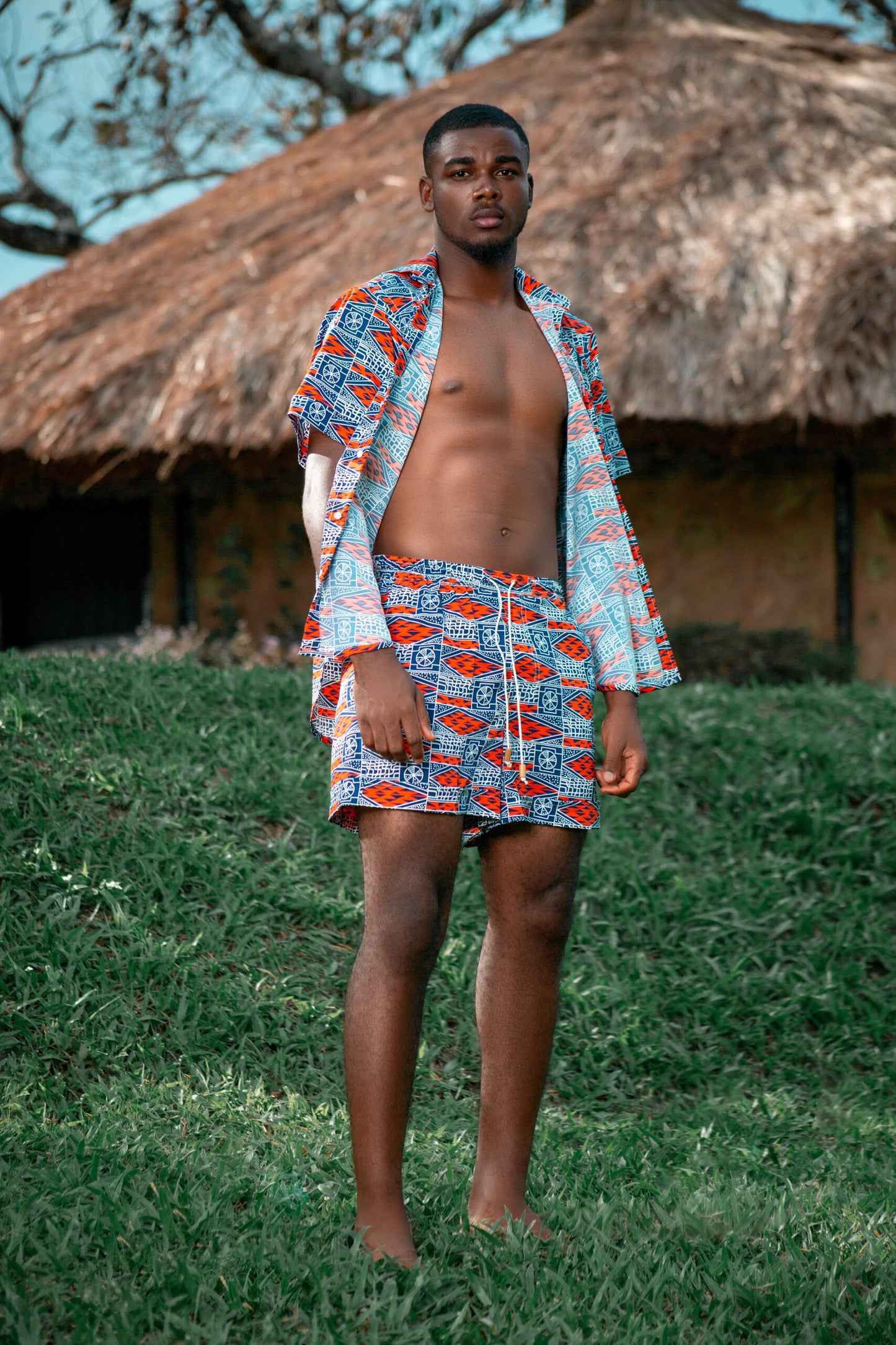 Model in relaxed stance showcasing short-sleeve shirt and shorts