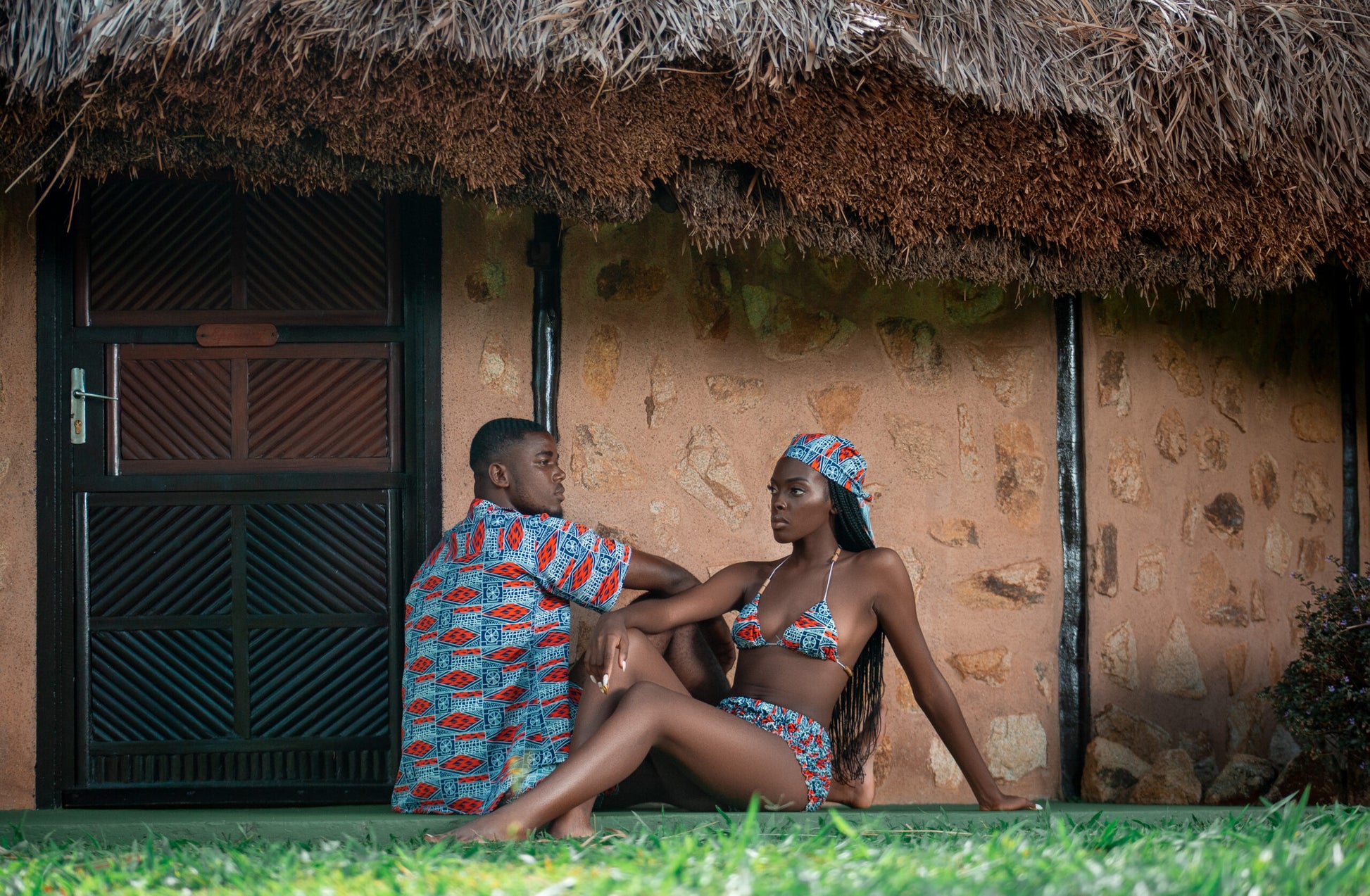 Seated couple in matching sets emphasizing cultural harmony